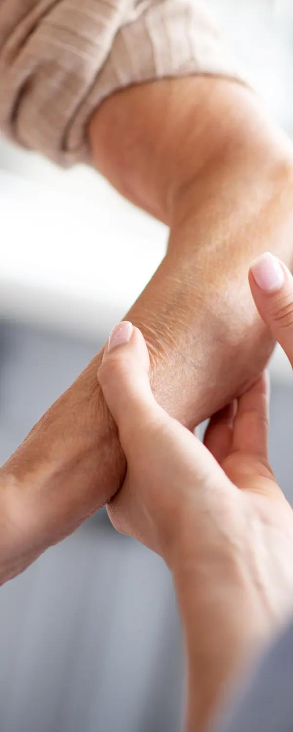 Chiropractor treating a patient’s forearm