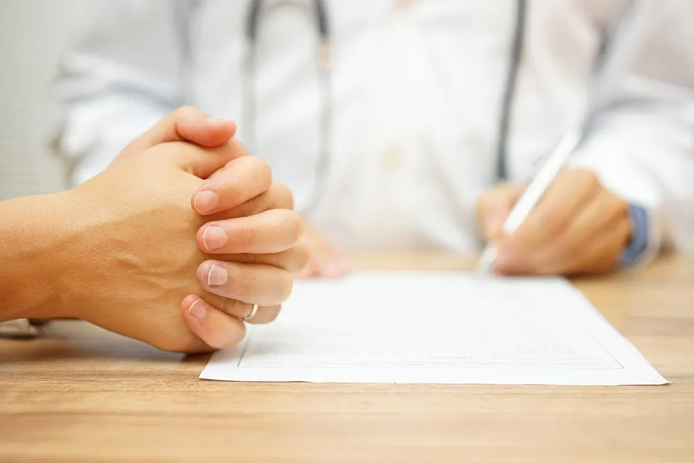 Chiropractor reviewing a report of findings